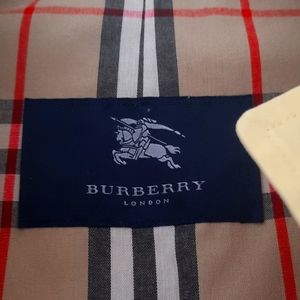 Yellow Burberry belted trench coat with hood